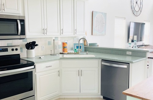 East End House | STAY SALTY~ Pool, Gorgeous Bay Views, In Town Center & Golf Cart Friendly Area.
