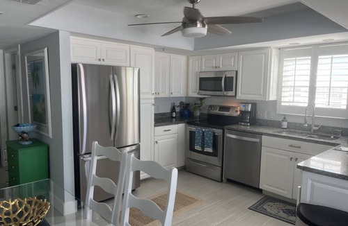 Mid Island House | Steps away from the sugar white sands and blue water!