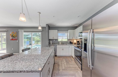 Oakland Hills House | Stocked Pool Home Canal View 8 Miles Beaches, Golfing, Fishing, Entertainment!