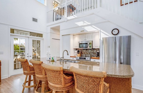 Bokeelia House | Stunning canal-front home with pools, AC, W/D & hammock