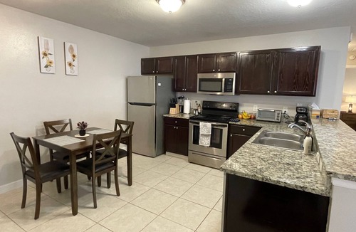 Duval House | Stylish Home in Duval w/Granite, Tile Floors, Glass Lanai & Gas Golf Cart!