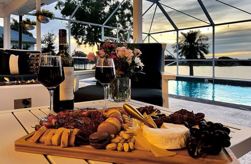 Wellington Villa | Stylish Lake Luxe Equine, on waterfront w screened-in pool - Lake Views! Hosted By Relaxtay
