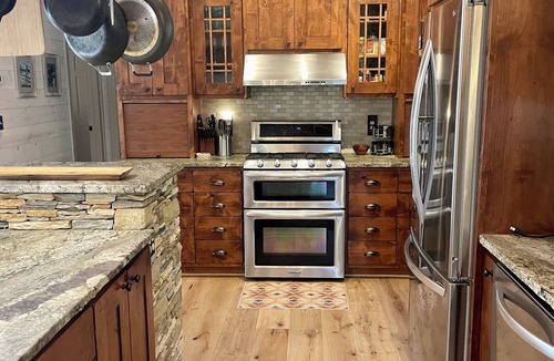 Cullowhee House | Stylish lakefront home with large flat yard, boat dock, hot tub & mountain view!
