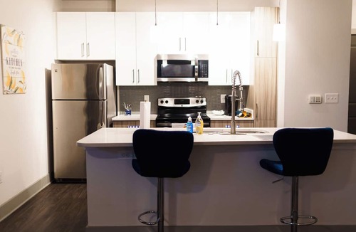 Westside Apartment | Stylish West Midtown Retreat with Rooftop Pool, Steps to the Stadium