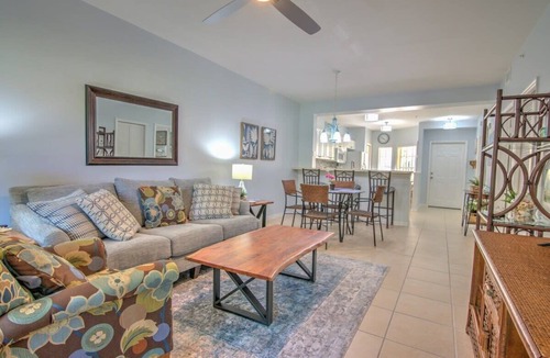 Ole Condo | Sunny Coral Falls With Vibrant Tropical Colors