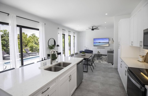 East Naples House | THE OASIS, Brand New Home, Screened in Heated Pool, Close to 5th Ave and Beach