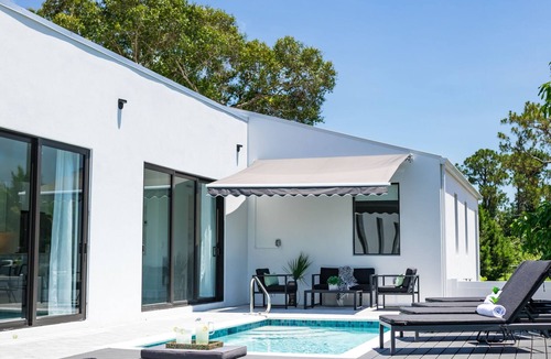 East Naples House | THE OASIS, Brand New Home, Screened in Heated Pool, Close to 5th Ave and Beach