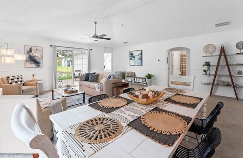 Sandalwood House | This home away from home features a gorgeous view of the lake from the spacious Great Room