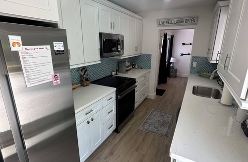 Lake Worth House | This modern 4-bedroom home sleeps 8 with 5 beds, 2 baths & a private pool.