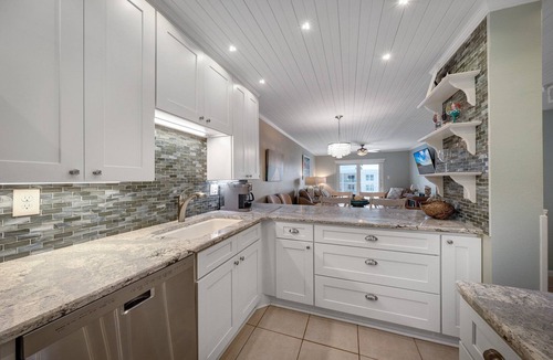 Brown Condo | Top-floor condo with ocean and pool views, private balcony, and multiple beachfront pools