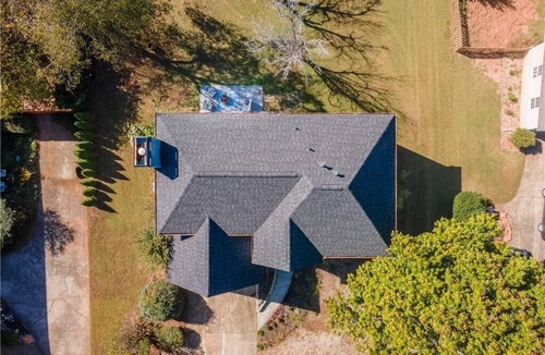 Cumming House | Traditional Home with Long Level Driveway offers media room and 4/2.5