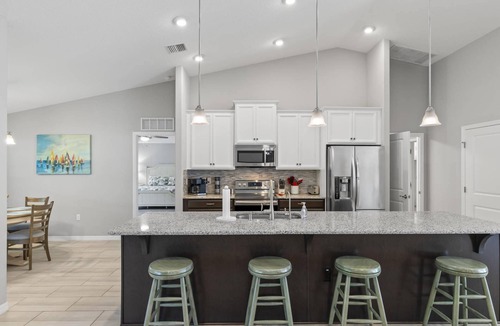Palm Coast House | Tropical Bliss Waterfront Home | Palm Coast | Screened Lanai | Close To The Beach | Garage Access
