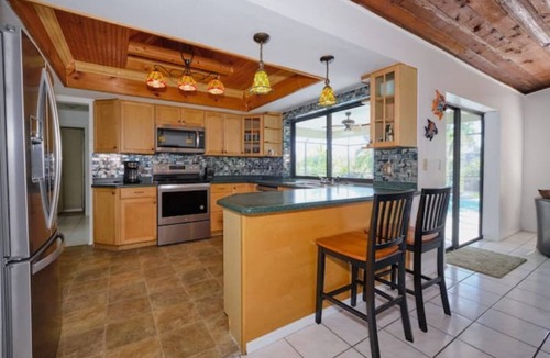 Pelican House | Tropical Home with Heated Pool