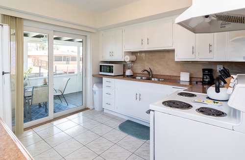 Melaleuca Gardens House | Tropical oasis with canal views. A fishing adventure near the beach!