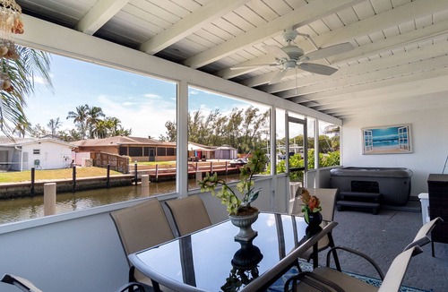 Melaleuca Gardens House | Tropical oasis with canal views. A fishing adventure near the beach!