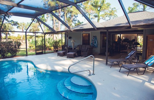 Palm City House | Tropical Paradise! Heated Pool & Sauna. Large very private yard. Near Everything
