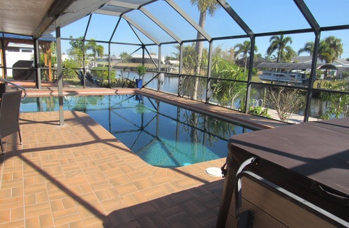 Port Charlotte House | Tropical Retreat! Hot tub, pool, Kayaks, pool table, games and Gulf access.