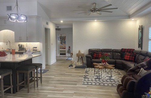 Jupiter House | Tropical waterfront oasis with private dock, pool, waterfall spa, tiki huts.