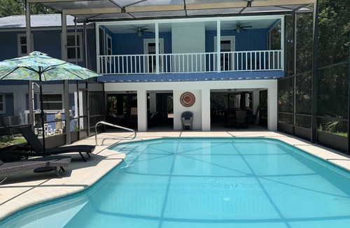 Englewood House | Tucked Away on Wooded Way located blocks from Manasota Beach with Heated Pool.