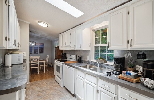 Whittier House | Twin Ponds Retreat-Pond/Hot Tub/Fire Pit/Game Room/Pet Friendly by RedAwning