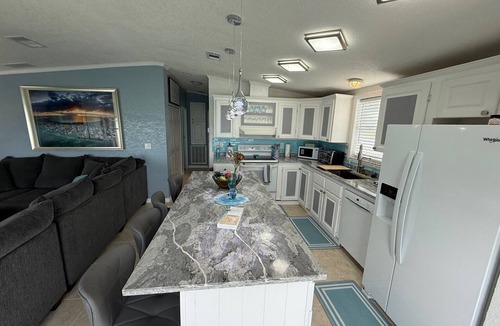 Cudjoe Key House | TWO HOMES A MID Rise and High Rise 85ft of Sea Wall.