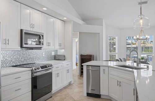 Pelican House | Unbeatable Direct Gulf Access Heated Pool Home with a Hot Tub and 6 bedrooms!