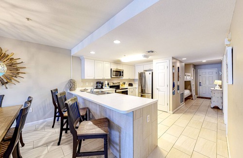 Miramar Beach Condo | Updated 1st-floor condo with large private balcony, pool, grills, firepit, & gym