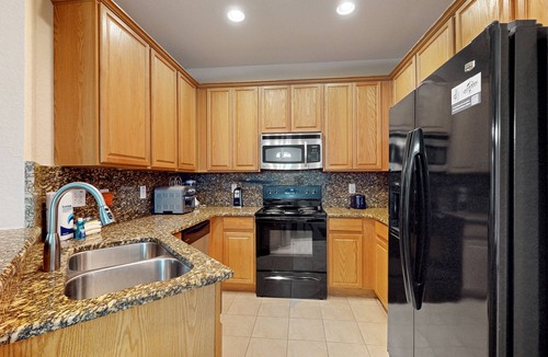 Trafalgar Village House | Updated retreat with pool access, W/D, AC, & patio - close to Disney Parks