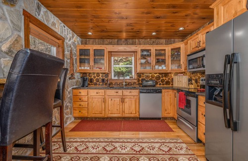 Elk Park Cabin | Upscale mountain log cabin with decks, fireplaces, & two primary bedrooms
