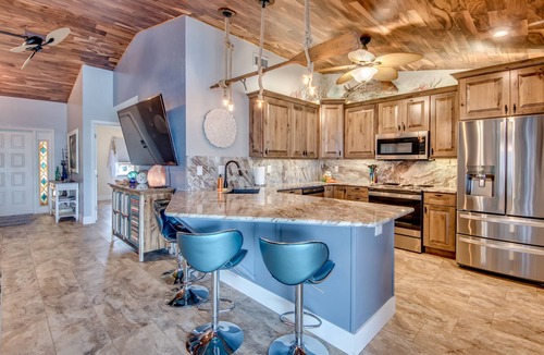 Matlacha Isles Villa | Fun'n Sun-Charming 3 BR/3 baths waterfront villa- pool, spa, dock, fishing poles