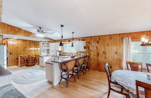 Franklin House | View-worthy home lined by trees with a fireplace, wrap-around deck, grill, & W/D