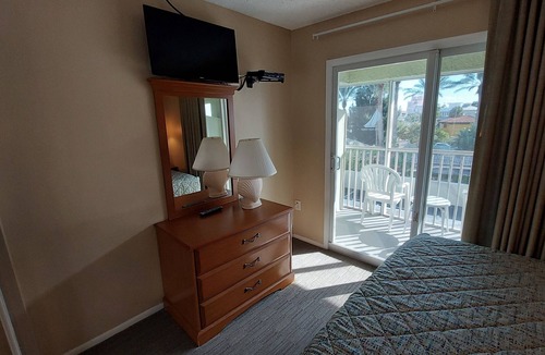 Belle Vista Resort | Walk out to the Beach from your 2 Bedroom Condo or swim in the pool. Sleeps 6