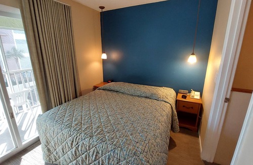 Belle Vista Resort | Walk out to the Beach from your 2 Bedroom Condo or swim in the pool. Sleeps 6