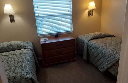 Belle Vista Resort | Walk out to the Beach from your 2 Bedroom Condo or swim in the pool. Sleeps 6