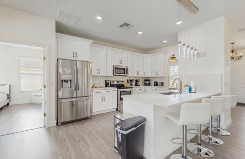 Trafalgar Village House | Water view retreat with lanai, heated pool, pool spa, game room, & AC
