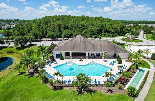 Trafalgar Village House | Water view retreat with lanai, heated pool, pool spa, game room, & AC
