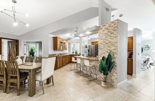 Pelican House | Waterfall saltwater Lagoon heated pool, 2 King Suites, Sauna!