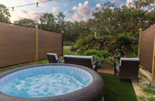 Sugarmill Woods Cabin | Waterfall Suite at Zen at the Palms with a Private Hot Tub by the Waterfall!