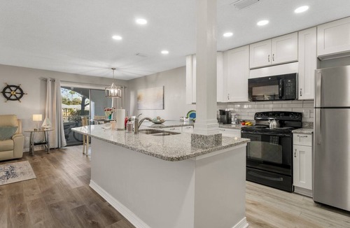 Gulf Lagoon Beach Condo | Waterfront boat dock,very close to beach, pool, tennis courts, and sauna.