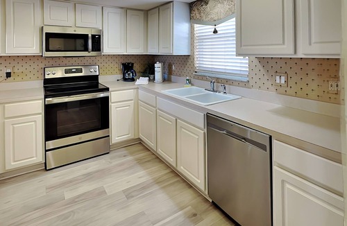 South Island Condo | Waterfront Condo- Balcony, Community Pool, Dock+ Canal Access
