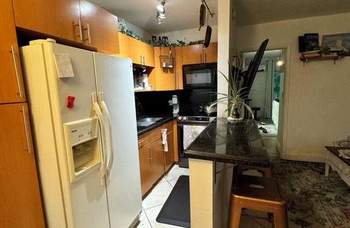 North Miami Condo | Waterfront Condo with Fishing, Paddleboard, and yard access.
