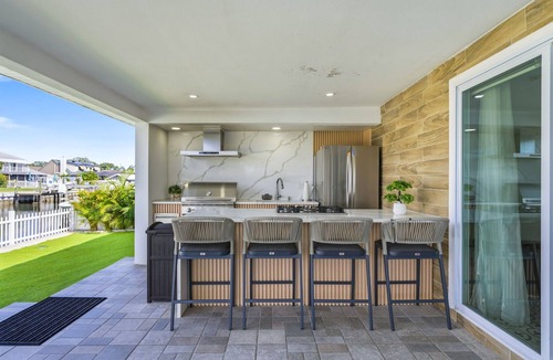 Bay Crest Park House | Waterfront~Heated Pool~Home Gym~Fire Pit