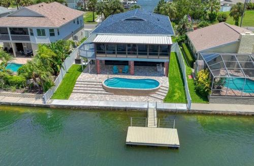 Spring Hill House | Waterfront home with pool and gameroom!