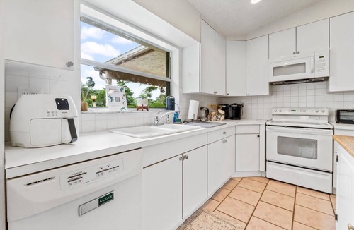 North Central Hollywood House | Waterfront Paradise with Tropical Palms, Swimming Pool & Hot Tub + Huge Backyard