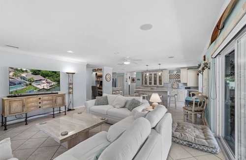 Palm Harbor House | Waterfront Retreat with Pool, Tiki Bar & Boat Dock