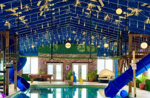 Bryant House | Wood Haven Cabin with a hot tub fire pit & indoor pool