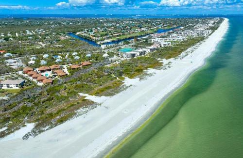 Sanibel House | Your Island Escape - Spacious Retreat with Wrap-Around Lanai and Private Beach
