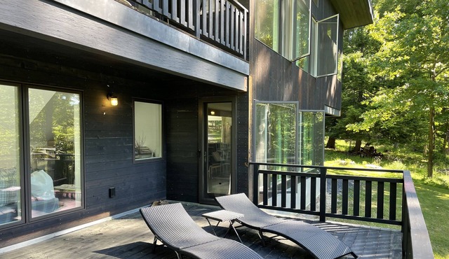 Architectural Modern escape tucked in a quiet wooded neighborhood in Kingston