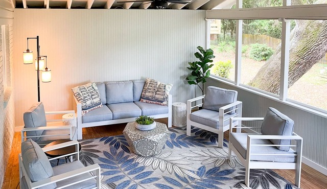 Beachy haven with a beautiful screened in porch and big yard