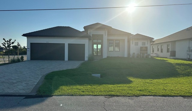 Beautiful 2023 NW Cape Coral waterfront home with pool, hot tub, dock, kayaks